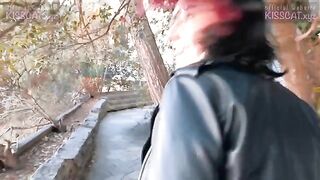 A student is having fun with a guy while her cat is being fed by a stranger