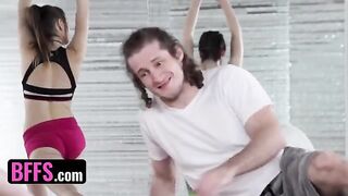 A yoga enthusiast is having fun with his teacher and classmates during a session