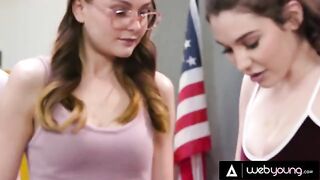 Two girls are trying to do their homework, but a third girl is distracting them
