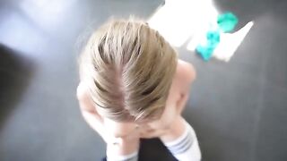 A sweet girl is having fun with a young man in the gym