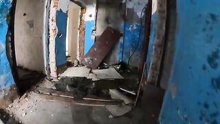 A sexy babe is walking around horrible buildings in a daring act