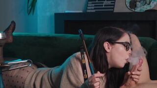 A sexy girl in glasses smokes and sucks cock while getting her pussy eaten in 69 position