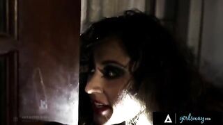 An investigator, played by the petite and adventurous Riley Reid, grills a hooker, portrayed by the stunning Reena Sky, on a couch