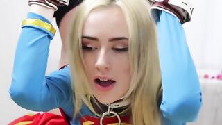 Candy White, aka Supergirl, in bondage solo action, showcasing her slim figure and 32A curves