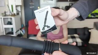 The girl is checking a new sex toy for her future use