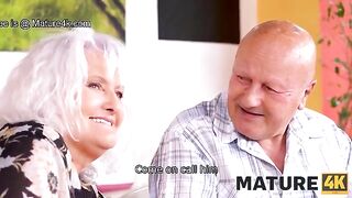 A mature woman gets fucked on the table in front of her husband