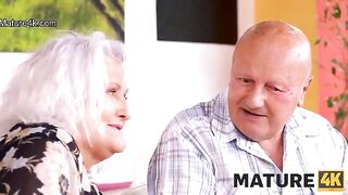 A mature woman gets fucked on the table in front of her husband