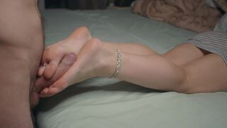 Petite beauty shows small feet and does foot job, ending with cum on soles