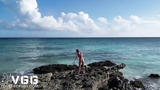 A sexy petite girl is fucking on the naked beach