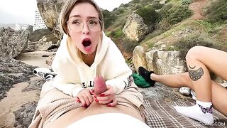 Two young girls are having fun on the beach with strangers