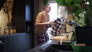 A couple was caught in the kitchen, engaged in intimate moments