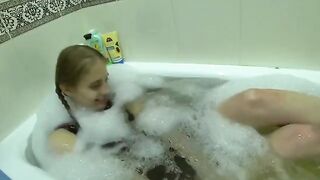 A girl seduces her friend's wife and fucks with her in the kitchen