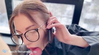 A woman talks on the phone with her husband while her friend has sex with her