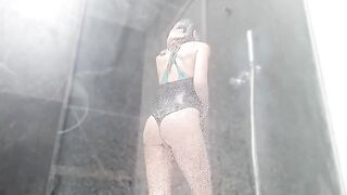 The girl has a wet pussy orgasm in the shower