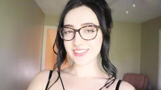 The cute girl is reading a hilarious book and trying not to cum