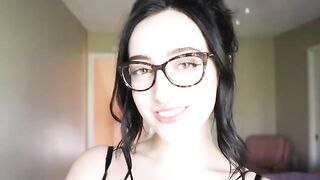 The cute girl is reading a hilarious book and trying not to cum