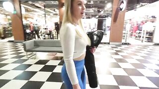 The hot blonde is fucking in the shopping mall toilet for money