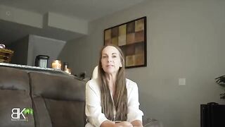 A stepmom shares a couch with her stepson in a taboo roleplay