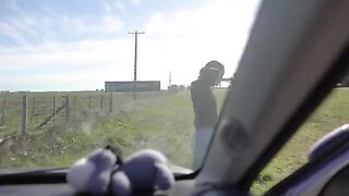 The girl is having fun with her boyfriend on a road trip