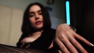 A sexy girl with big boobs gets naked on the sofa in oil