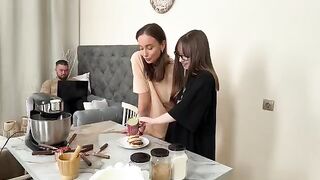 Two girls have a rest while cooking Russian syrniki together