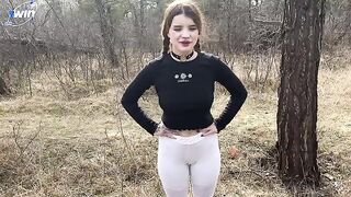 A hot chick is fucking in the forest, her tight pussy exposed