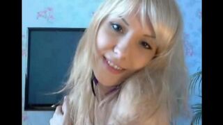The blonde caresses her pussy with her fingers in a steamy solo session