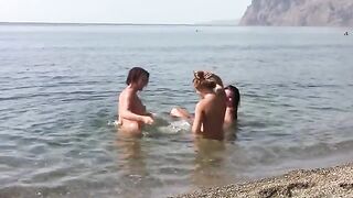 Three hot girls with no bras got naked on the coast