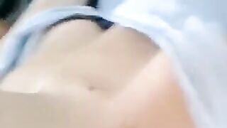 A half-naked lie and caress her body with her hands in a sensual way