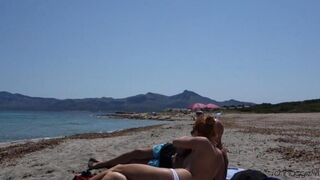 Public blowjob with a man on the beach, ending with a cum shot