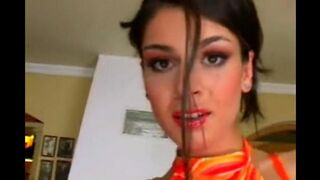Beautiful brunette masturbating on a leather chair