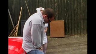A hot nurse is having fun with a guy in his car