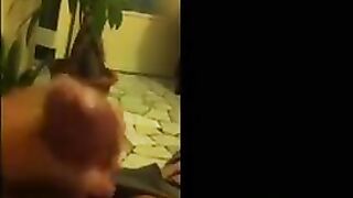 Fingers of the guy through his pants, removing on the mobile phone