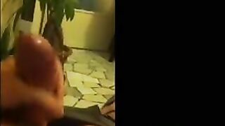 Fingers of the guy through his pants, removing on the mobile phone