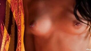 A girl with a nipple piercing plays with her fingers in the 60fps video