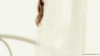 A young and pretty woman masturbates passionately, showcasing her seductive allure
