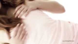 A young and pretty woman masturbates passionately, showcasing her seductive allure