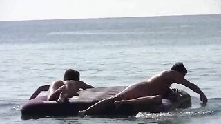 A girl sunbathes naked on the beach, showing her body in HD quality