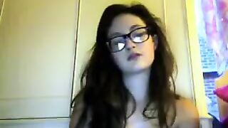 A cute student with glasses takes off her clothes on cam