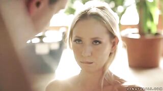 A cute blonde, Kiara Lord, gently rides her husband, showcasing her sensual skills