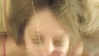 A cum shot on the face of a hot blonde after an amazing blowjob