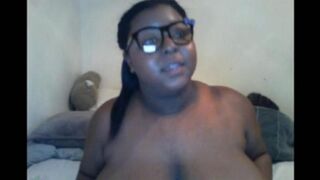 The black woman closed the camera with her big natural milking tits during a steamy webcam show
