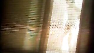 The camera is working properly. A girl is exercising naked