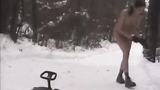 Nude girls have fun with snowballs on the city streets
