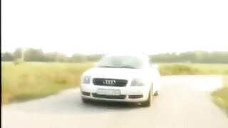 A girl with a shaved pussy is given on the bonnet, showcasing passionate outdoor action