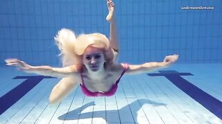 Nude beauty swimming in the pool is a very exciting sight to see