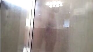 A guy washed his body in the shower, not knowing he was being filmed
