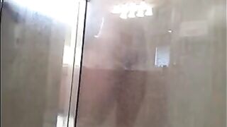 A guy washed his body in the shower, not knowing he was being filmed