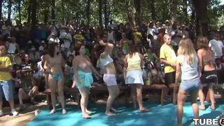 A young girl has fun with someone in the forest, getting wild