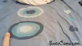 The girl tests her new toys in front of the webcam